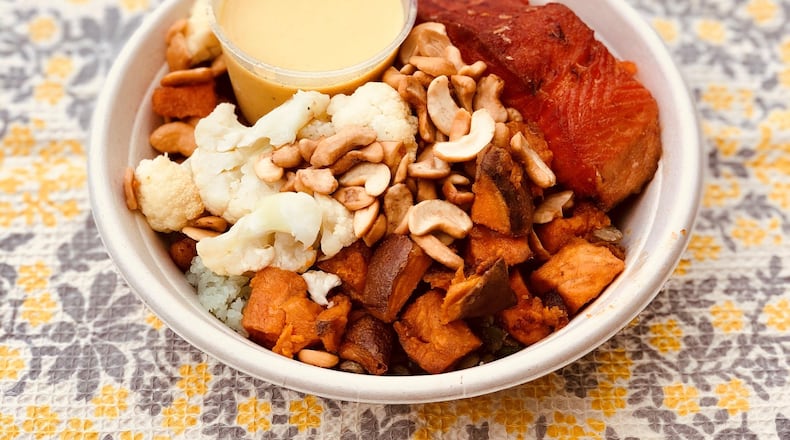 This build-it-yourself bowl from Upbeet features steelhead trout, bamboo rice, cauliflower, green lentils, roasted chickpeas, sweet potatoes, cashews, pickled onions and curry coconut dressing. CONTRIBUTED BY WENDELL BROCK