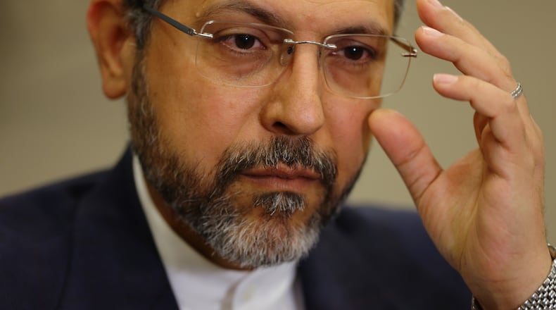 Iran's Deputy Foreign Minister Saeed Khatibzadeh adjusts his glasses as he talks during an interview with Associated Press at the Antalya Diplomacy Forum, in Antalya, southern Turkey, Saturday, April 18, 2026. (AP Photo/Riza Ozel)