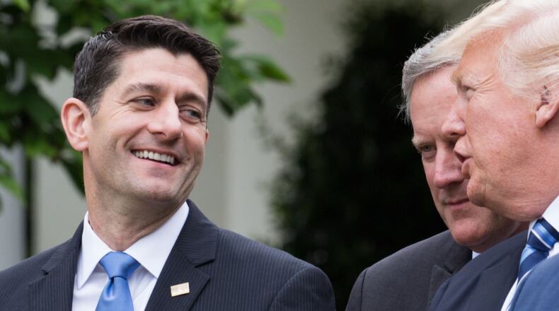 President Donald Trump (right) and House Speaker Paul Ryan celebrated the passage of legislation to roll back the Affordable Care Act.