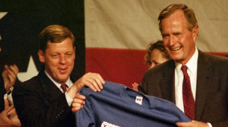 U.S. Sen. Johnny Isakson and George H.W. Bush in 1990, when Isakson was running for governor. AJC file.