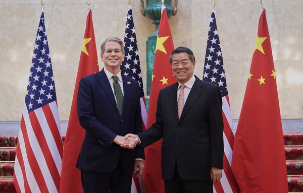 In this photo released by Xinhua News Agency, Chinese Vice Premier He Lifeng, right, shakes hands with U.S. Treasury Secretary Scott Bessent before their meeting to discuss China-U.S. trade, in London, Monday, June 9, 2025. (Li Ying/Xinhua via AP)