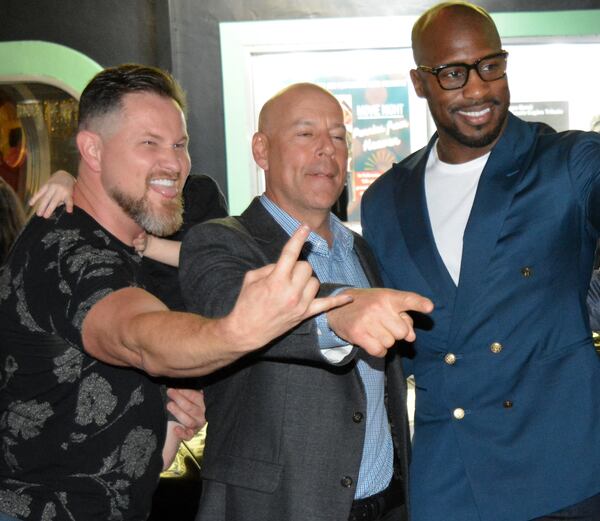 Producer Alexander Kane poses with actors Bruce Willis and Vernon Davis outside of the Tift Theatre. (Courtesy of Carlton Fletcher)