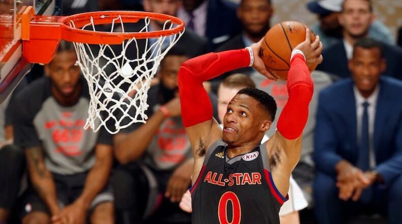Western Conference guard Russell Westbrook of the Oklahoma City Thunder (0) makes a dunk during the first half of the NBA All-Star basketball game in New Orleans, Sunday, Feb. 19, 2017. (AP Photo/Max Becherer)