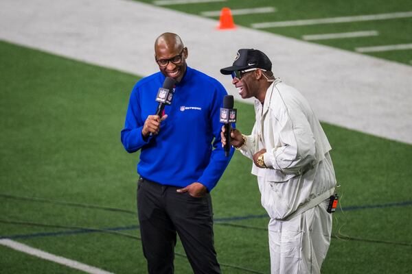 Colorado State head coach Deion Sanders interviews with NFL Network's Bucky Brooks during the Big 12 Conference's NFL football pro day Thursday, March 20, 2025, in Frisco, Texas. (AP Photo/Jessica Tobias)