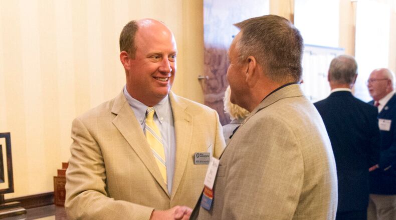 FILE - In this Sept. 11, 2018, file photo, Will Ainsworth, center, then-Republican nominee for lieutenant governor, talks with constituents during the Public Retiree Convention at Renaissance Hotel in Montgomery, Ala. Lt. Gov. Ainsworth, who has called the state mask order a government overstep, announced Wednesday, Oct. 21, 2020, that he tested positive for the new coronavirus. (Jake Crandall/The Montgomery Advertiser via AP, File)