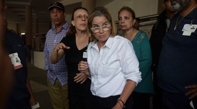Mayor Carmen Yulin Cruz arrives at San Francisco hospital in Rio Piedras area of San Juan, Puerto Rico, Saturday, Sept. 30, 2017, as about 35 patients are evacuated after the failure of an electrical plant. (AP Photo/Carlos Giusti)