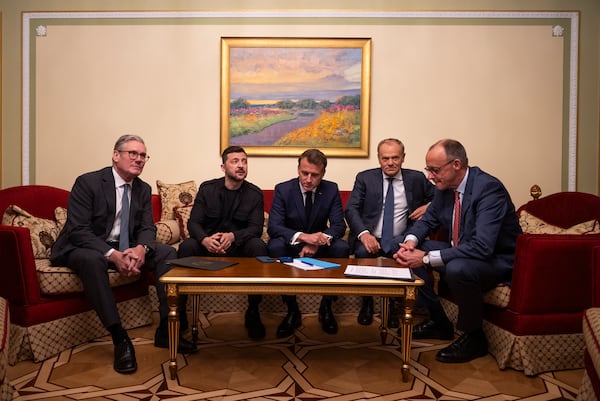 From left, British Prime Minister Keir Starmer, President Volodymyr Zelenskyy, French President Emmanuel Macron, Polish Prime Minister Donald Tusk and German Chancellor Friedrich Merz make a call to U.S. President Donald Trump from Kyiv, Ukraine, on Saturday, May 10, 2025. (AP Photo/Mstyslav Chenov)