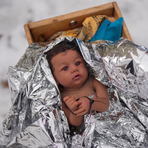 A doll representing the baby Jesus is zip-tied in the Nativity scene outside of Lake Street Church of Evanston, Wednesday, Dec. 10, 2025, in Evanston, Ill. (AP Photo/Erin Hooley)