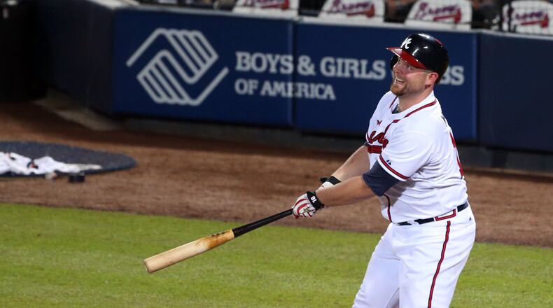 Atlanta Braves catcher Brian McCann (16) watches his long fly ball caught for an out during the 4th inning during the first game of the National League Division series between the Los Angeles Dodgers and Atlanta Braves at Turner Field, Thursday, October 3, 2013.