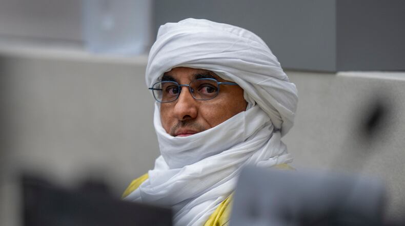 FILE - Al Hassan Ag Abdoul Aziz Ag Mohamed Ag Mahmoud waits for judges to enter the courtroom of the International Criminal Court in The Hague, Netherlands, on June 26, 2024, to deliver the verdict in the trial of Al Hassan, accused of playing a key role in a reign of terror unleashed by al-Qaida-linked insurgents on the historic desert city of Timbuktu in northern Mali in 2012. (AP Photo/Peter Dejong, Pool, File)