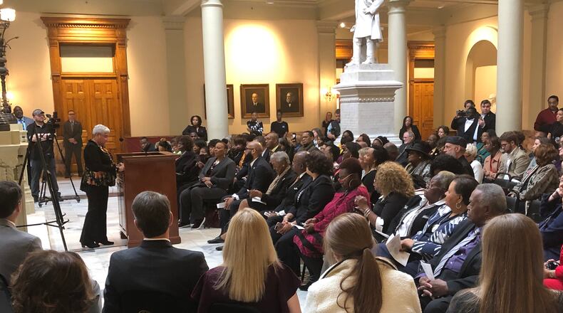 Former Atlanta Mayor Shirley Franklin speaks at a statehouse ceremony honoring Martin Luther King Jr. while Gov. Brian Kemp and his family listen. AJC/Greg Bluestein