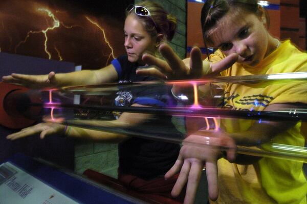 Children experience the Plasma Wal' electricity exhibit during the last day of operation for Sci-Trek science museum in 2004.  (Special/John Amis)