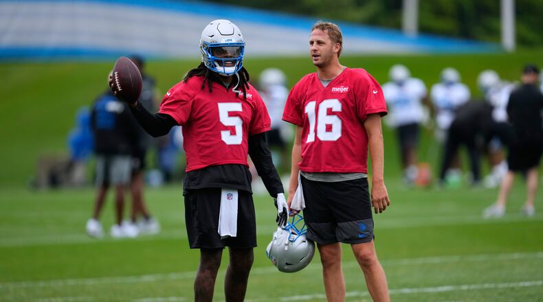 Detroit Lions quarterbacks Teddy Bridgewater (5) talks with Jared Goff (16) during practice at the NFL football team's training camp, in Allen Park, Mich., Sunday, Aug. 2, 2026. (AP Photo/Paul Sancya)