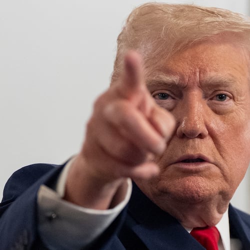 President Donald Trump speaks to reporters after speaking to troops via video from his Mar-a-Lago estate on Thanksgiving, Thursday, Nov. 27, 2025, in Palm Beach, Fla. (AP Photo/Alex Brandon)