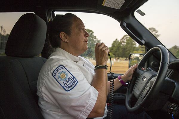 Wilkes County Deputy EMA Director and paramedic Amy Howard radios to a dispatched EMS truck for a location while driving a rapid response vehicle during her morning shift in Washington, Thursday, October 3, 2019. Howard says her “second life” started when she became a paramedic. (Alyssa Pointer/Atlanta Journal Constitution)