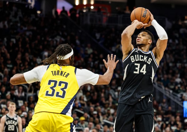 Milwaukee Bucks' Giannis Antetokounmpo (34) shoots against the Indiana Pacers' Myles Turner during the first half of Game 4 of a first-round NBA basketball playoff series Sunday, April 27, 2025, in Milwaukee. (AP Photo/Jeffrey Phelps)