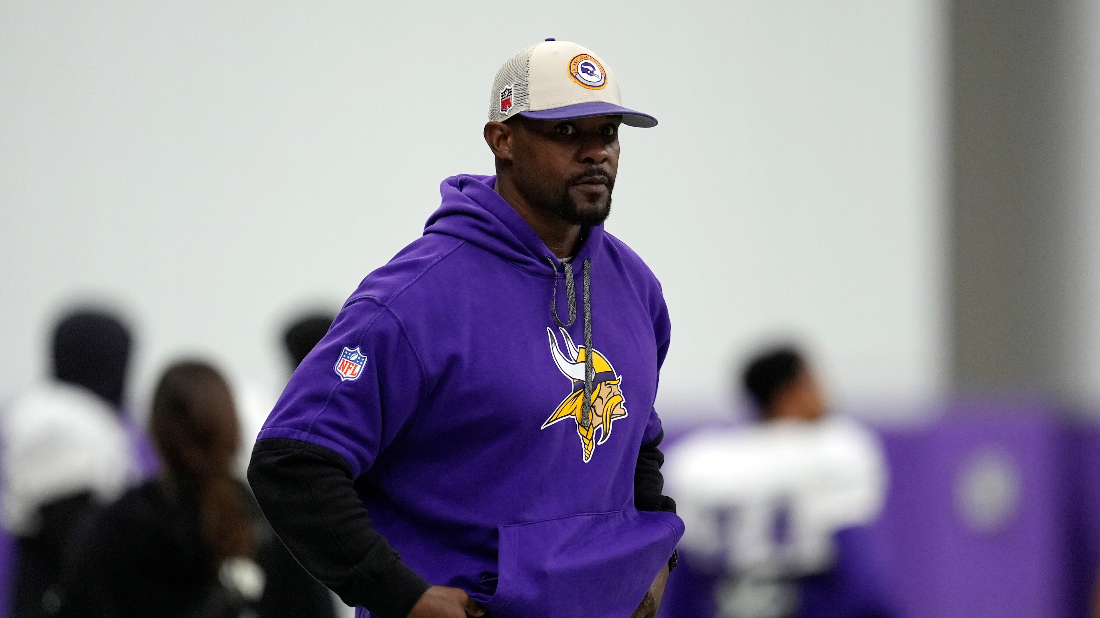 FILE - Minnesota Vikings defensive coordinator Brian Flores stands on the field during an NFL football workout in Eagan, Minn., Oct. 30, 2024. (AP Photo/Abbie Parr, File)