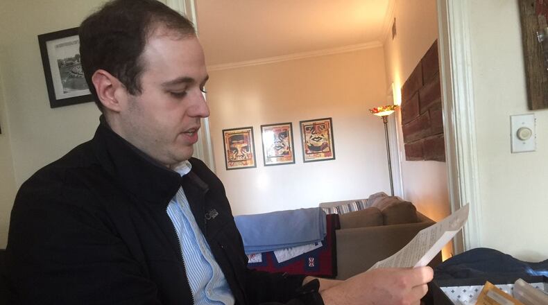 Alex Robson reads a letter from Manson family member Susan Atkins explaining what freedom means to her. ERIC STIRGUS / ESTIRGUS@AJC.COM