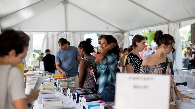 Visitors check out a booth during the 2017 AJC Decatur Book Festival. Now in its 13th year, the annual Labor Day weekend event is the largest independent book festival in the country. CONTRIBUTED BY BRANDEN CAMP
