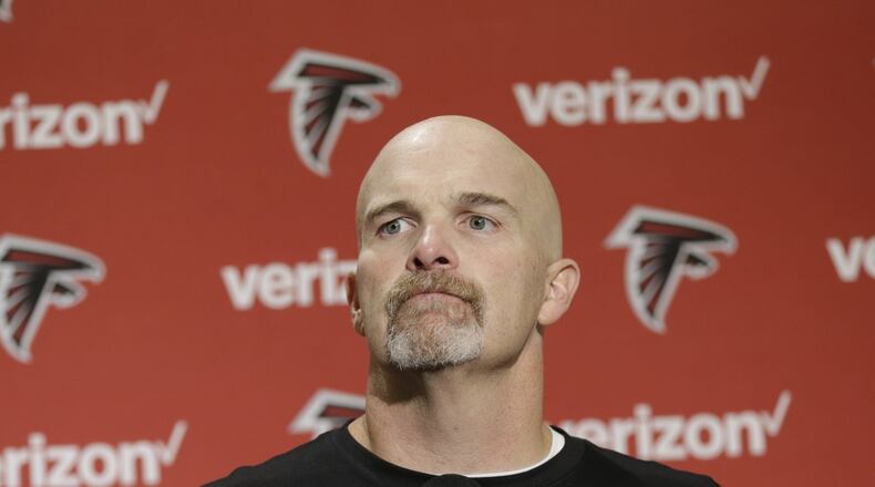 Atlanta Falcons head coach Dan Quinn talks to reporters in a post-game press conference following an NFL football game against the Seattle Seahawks, Sunday, Oct. 16, 2016, in Seattle. (AP Photo/Stephen Brashear)