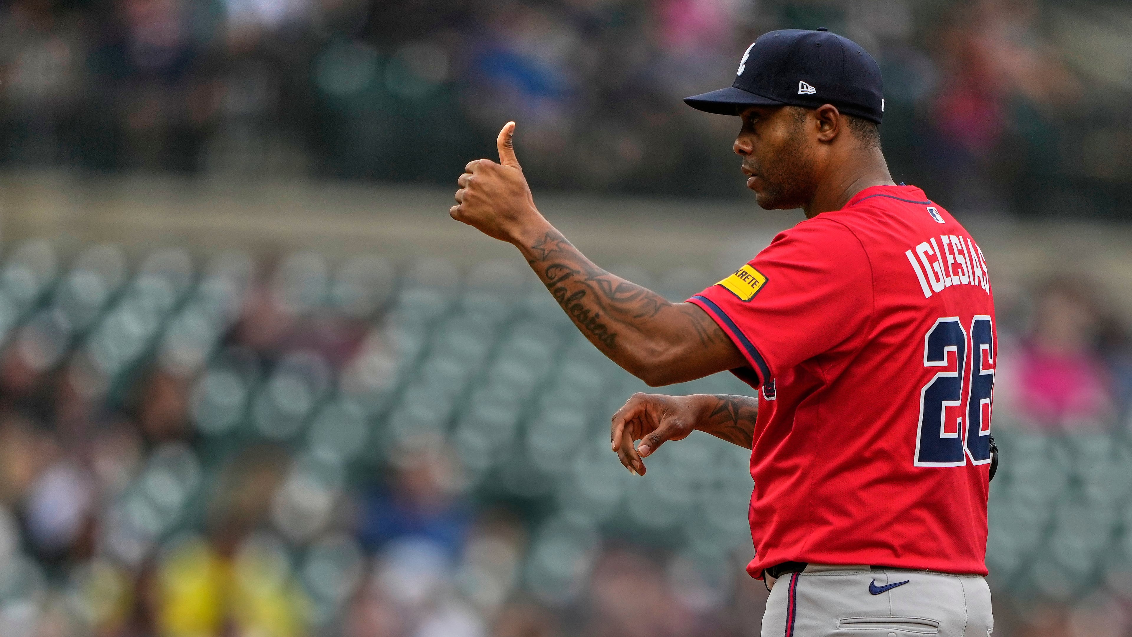 Atlanta Braves relief pitcher Raisel Iglesias gestures during the ninth inning of a baseball game against the Detroit Tigers, Sunday, Sept. 21, 2025, in Detroit. (AP Photo/Ryan Sun)