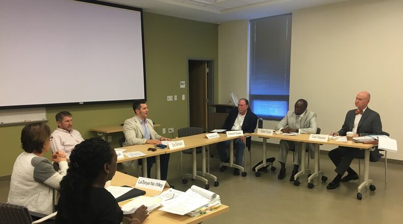 The DeKalb Board of Ethics voted 4-0 to approve an advisory opinion restricting solicitation of business donations for government events at the Central DeKalb Senior Center on Thursday, Oct. 19, 2017. From left: DeKalb Ethics Officer Stacey Kalberman, board member Brian Deutsch, DeKalb Deputy Ethics Officer LaTonya Nix Wiley, board Chairman Dan DeWoskin, board member Edward Queen, board member Robert Tatum and board attorney Gene Chapman. MARK NIESSE / MARK.NIESSE@AJC.COM