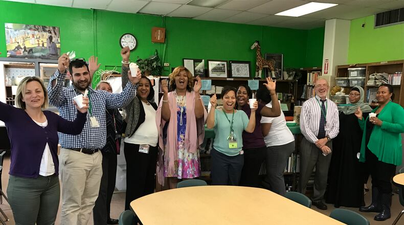 Ashford Park Elementary staff celebrate the school’s STEM certification.