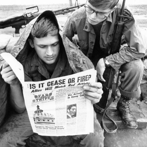 FILE - A GI with the U.S. 25th division reads Stars and Stripes newspaper at Cu Chi, South Vietnam on Sept. 10, 1969. (AP Photo/Mark Godfrey)