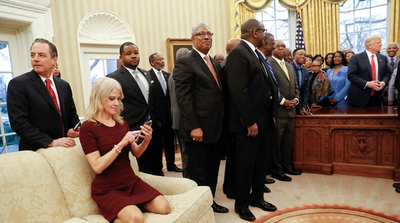 President Donald Trump, right, meets with leaders of Historically Black Colleges and Universities (HBCU) in the Oval Office of the White House in Washington, Monday, Feb. 27, 2017. Also at the meeting are White House Chief of Staff Reince Priebus, left, and Counselor to the President Kellyanne Conway, on the couch. (AP Photo/Pablo Martinez Monsivais)