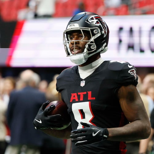 The Falcons used the franchise tag to sign tight end Kyle Pitts — pictured warming up before a November game against the Panthers — to a one-year, $15 million contract. (Miguel Martinez/AJC 2025)
