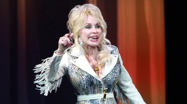 Dolly Parton, who played Infinite Energy Center earlier this year, will be honored with an lifetime achievement award at the CMAs. (Photo by Robb D. Cohen/Invision/AP)