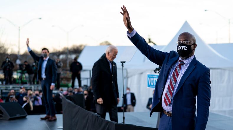 President-elect Joe Biden, center, while campaigning for Democratic Senate candidates Jon Ossoff, left, and the Rev. Raphael Warnock, right, in Atlanta on Monday, Jan. 4, 2021. After both won Senate seats, Biden told supporters he was “more optimistic than ever.” (Doug Mills/The New York Times)