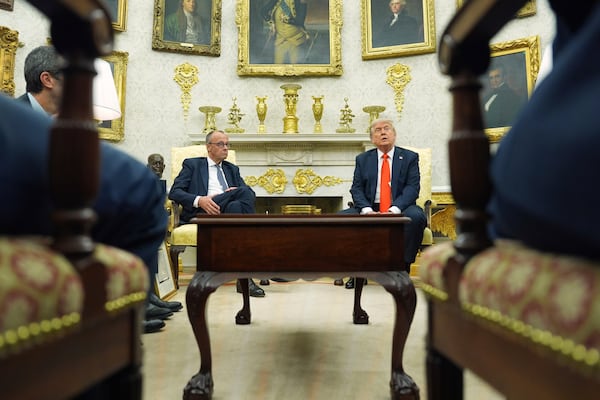 President Donald Trump, right, meets Germany's Chancellor Friedrich Merz in the Oval Office of the White House, Thursday, June 5, 2025, in Washington. (AP Photo/Evan Vucci)