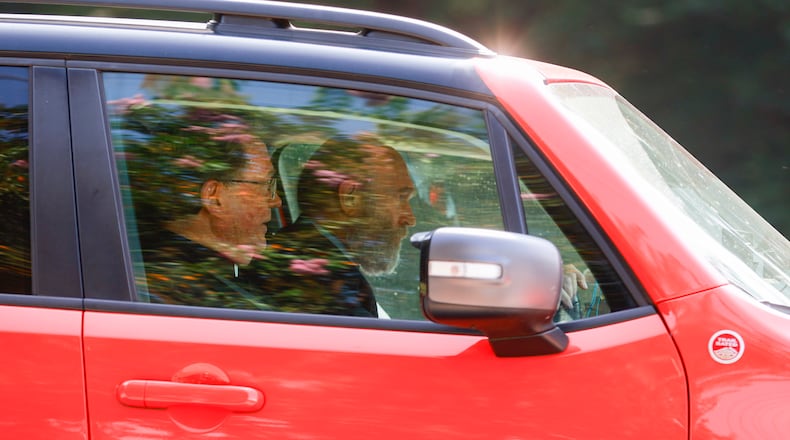 Stephen Lee (left) exits Fulton County Jail after surrendering on Friday, August 25, 2023. (Natrice Miller/natrice.miller@ajc.com)