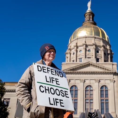 Jack Harvey holds a sign that reads "Protect life Choose Life." Georgia Right To Life held a silent march in the streets of downtown Atlanta to commemorate the anniversary of the 1973 Supreme Court ruling in Roe v Wade, Friday, Jan. 24, 2025 (Ben Hendren for the AJC)
