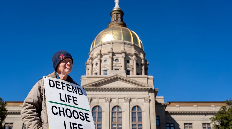 Jack Harvey holds a sign that reads "Protect life Choose Life." Georgia Right To Life held a silent march in the streets of downtown Atlanta to commemorate the anniversary of the 1973 Supreme Court ruling in Roe v Wade, Friday, Jan. 24, 2025 (Ben Hendren for the AJC)