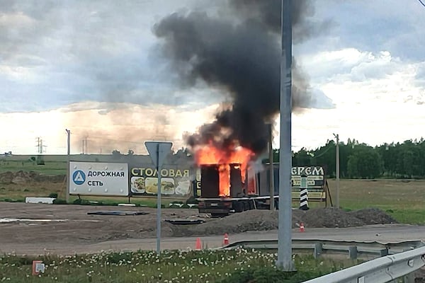 This photo released by Governor of Irkutsk region Igor Kobzev telegram channel on Sunday, June 1, 2025, shows a truck apparently used to release Ukrainian drones seen burning in the Irkutsk region, more than 4,000 kilometers (2,500 miles) from Ukraine. (Governor of Irkutsk region Igor Kobzev telegram channel via AP)