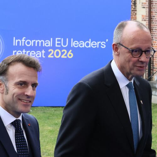 French President Emmanuel Macron, left, and Germany's Chancellor Friedrich Merz arrive for the EU summit at Alden Biesen Castle in Bilzen-Hoeselt, Belgium, Thursday, Feb. 12, 2026. (AP Photo/Francois Walschaerts)