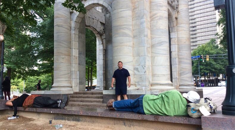 Ryan Toth, who owns or manages several condos at Peachtree Towers, says the residents and businesses have been almost under siege by bad behavior outside their front door. BILL TORPY / BTORPY@AJC.COM