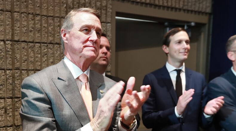 U.S. Senator David Perdue applaudes President Donald Trump during his speech at the Black Voices for Trump Coalition rollout on Friday, November 8, 2019, in Atlanta. Curtis Compton/ccompton@ajc.com