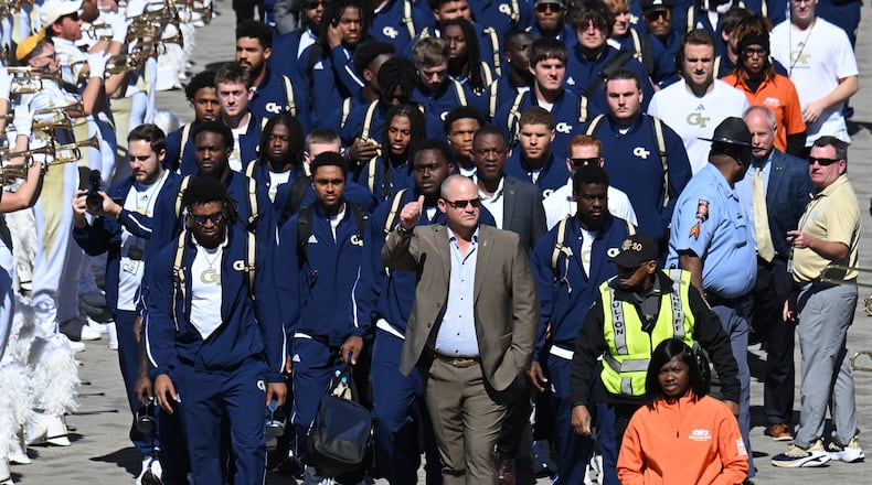 Georgia Tech head coach Brent Key and players arrive before the start of the Georgia Tech football game against Notre Dame at Mercedes-Benz Stadium, Saturday, October 19, 2024, in Atlanta. (Hyosub Shin / AJC)
