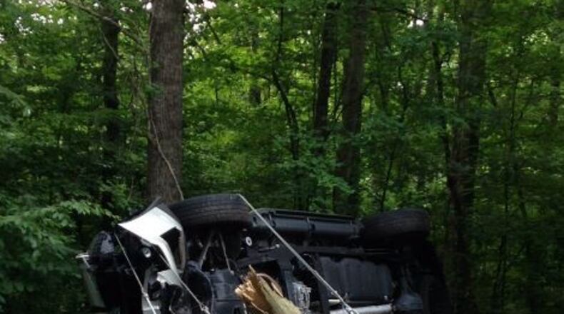 This overturned truck knocked down a power pole Saturday in Sandy Springs. (Credit: Twitter/SandySpringsGA)