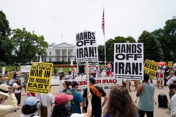 Demonstrators rally outside of the White House to protest last weekend's U.S. military strikes in Iran.