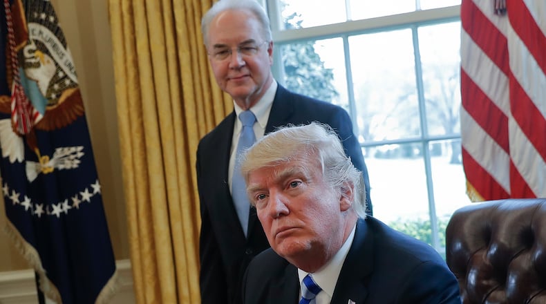 FILE - In this March 24, 2017 file photo, President Donald Trump with Health and Human Services Secretary Tom Price are seen in the Oval Office of the White House in Washington. Congress is launching a wide-ranging examination of air travel by high-ranking Trump administration officials. The House Oversight and Government Reform committee is following up on reports that health secretary Tom Price used pricey charters when cheaper commercial flights would have done. (AP Photo/Pablo Martinez Monsivais, File)