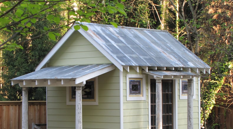 Jennifer Lauren and her husband, Rick Myers, built a shed with old tin and salvaged wood they bought from dealers at the Scott Antique Markets. Ben Jackson