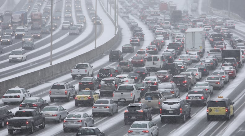 Roads and highways proved treacherous for commuting as a snow and ice storm hit the metro Atlanta area early on Tuesday, Jan. 28, 2014. Here's a look back at AJC photos from the day of the winter storm and the days of cleanup after the storm.