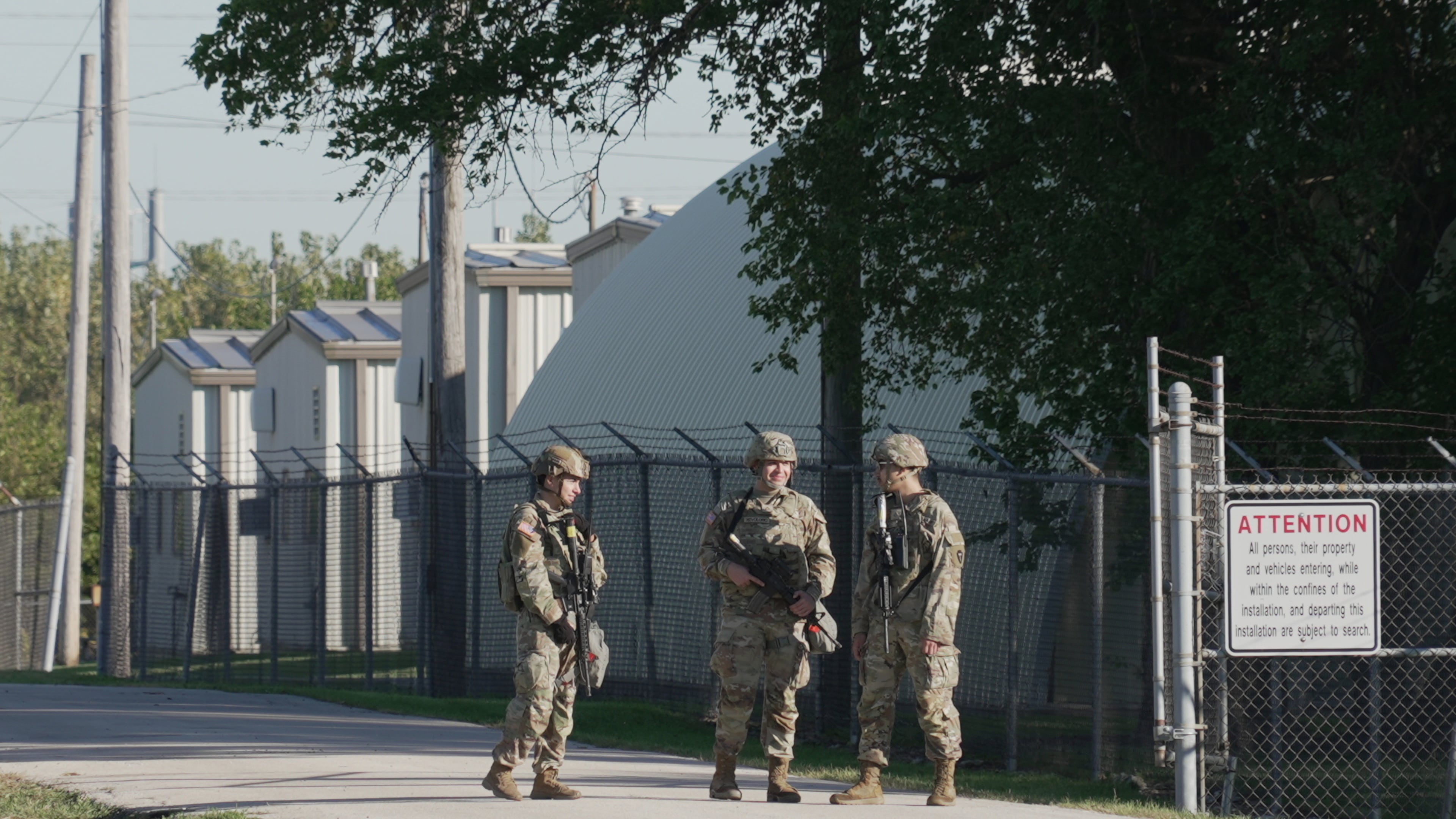 Military personnel in uniform, with the Texas National Guard patch on, are seen at the U.S. Army Reserve Center, Wednesday, Oct. 8, 2025, in Elwood, Ill., a suburb of Chicago. (AP Photo/Laura Bargfeld)