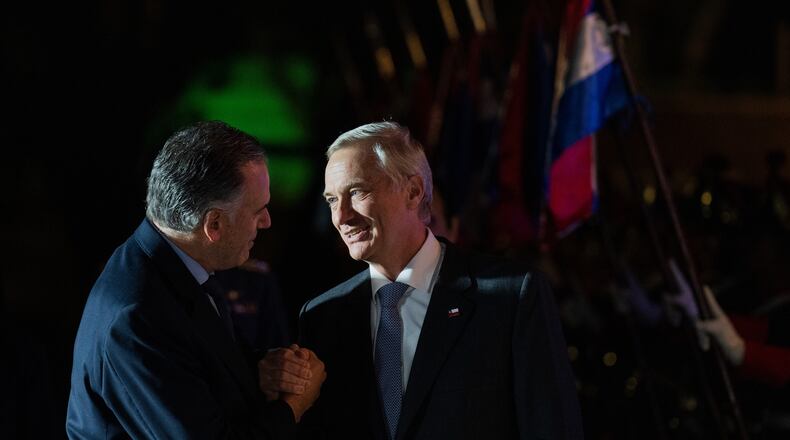 Uruguay's President Yamandu Orsi, left, shakes hands with Chile's President Jose Antonio Kast during an official meeting at the presidential residence in Montevideo, Uruguay, Wednesday, July 1, 2026. (AP Photo/Matilde Campodonico)