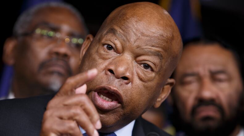 President-elect Donald Trump on Tuesday renewed his Twitter war with U.S. Rep. John Lewis, D-Atlanta, when Lewis’ comment that he had never skipped an inauguration before in his 30 years in Congress proved to be inaccurate. Lewis also missed the first inauguration of President George W. Bush in 2001 as part of a Congressional Black Caucus protest of the results of the November 2000 election, which was finally settled by the U.S. Supreme Court. (AP Photo/J. Scott Applewhite, File)