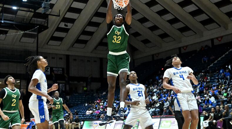 Greenforest's Daniel Daramola (32) dunks the ball against Manchester during the second half of GHSA Basketball Class A Division II Boy’s State Championship game at the Macon Centreplex, Wednesday, Mar. 6, 2024, in Macon. Greenforest Christian won 68-39 over Manchester. (Hyosub Shin / Hyosub.Shin@ajc.com)